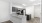 kitchen with grey cabinets, stainless steel appliances, and granite countertops