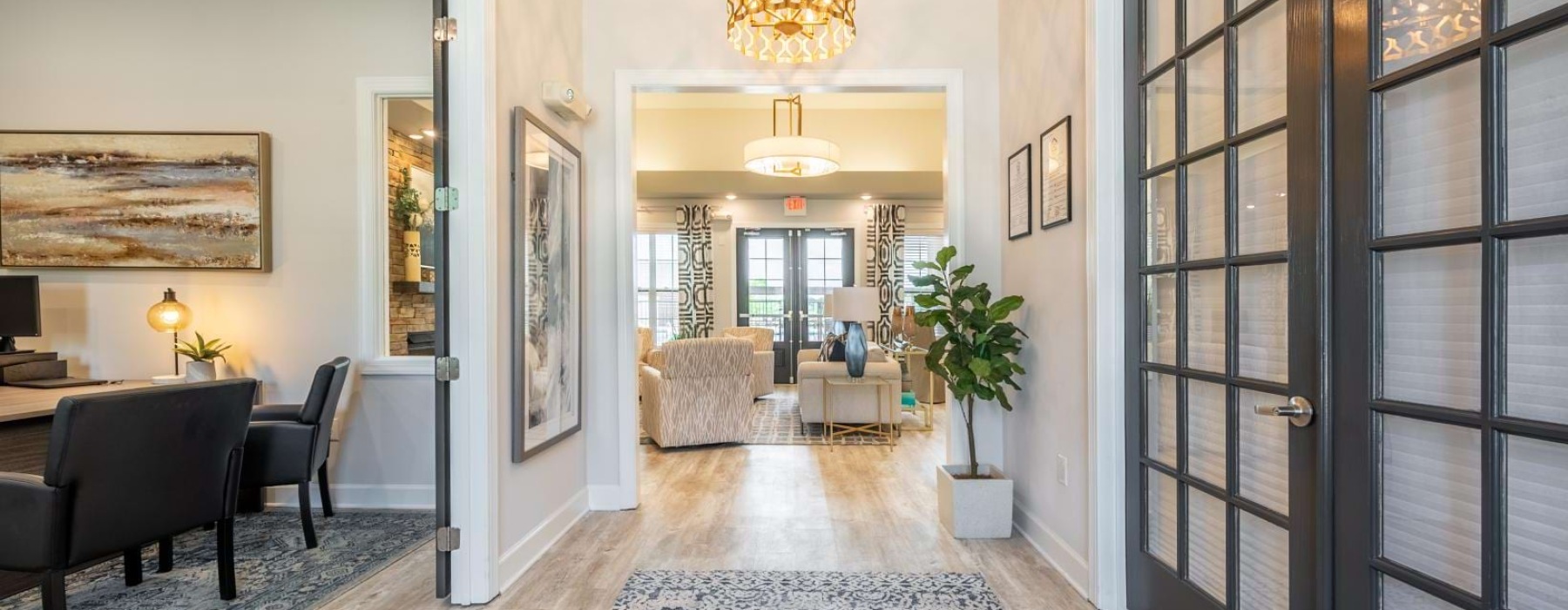 a room with a rug and a table with chairs and a rug