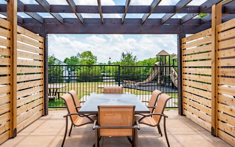 a table and chairs on a deck