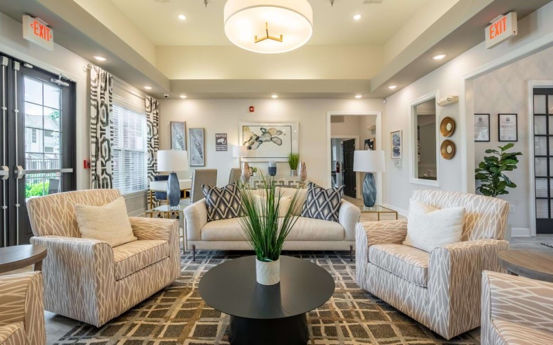 a living room with a chandelier and a table